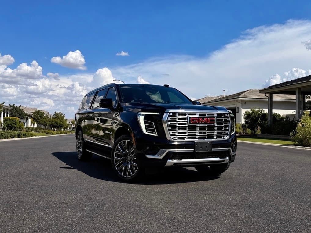 Detailed black GMC Denali parked on a residential street