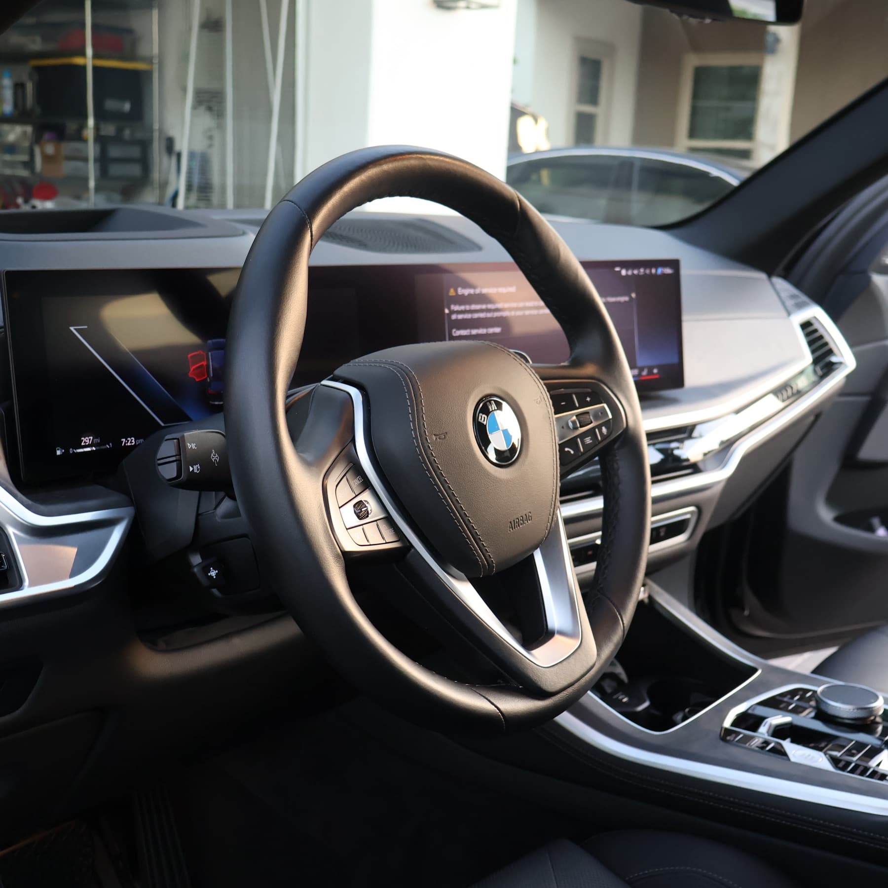 BMW steering wheel, dash and screens cleaned from the driver side